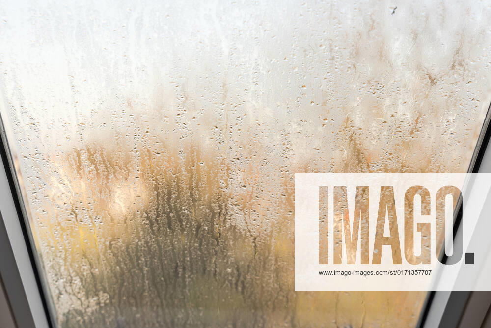 Germany, Bavaria - 31 October 2022: Fogged skylight in the morning. Water drops from condensation on a window