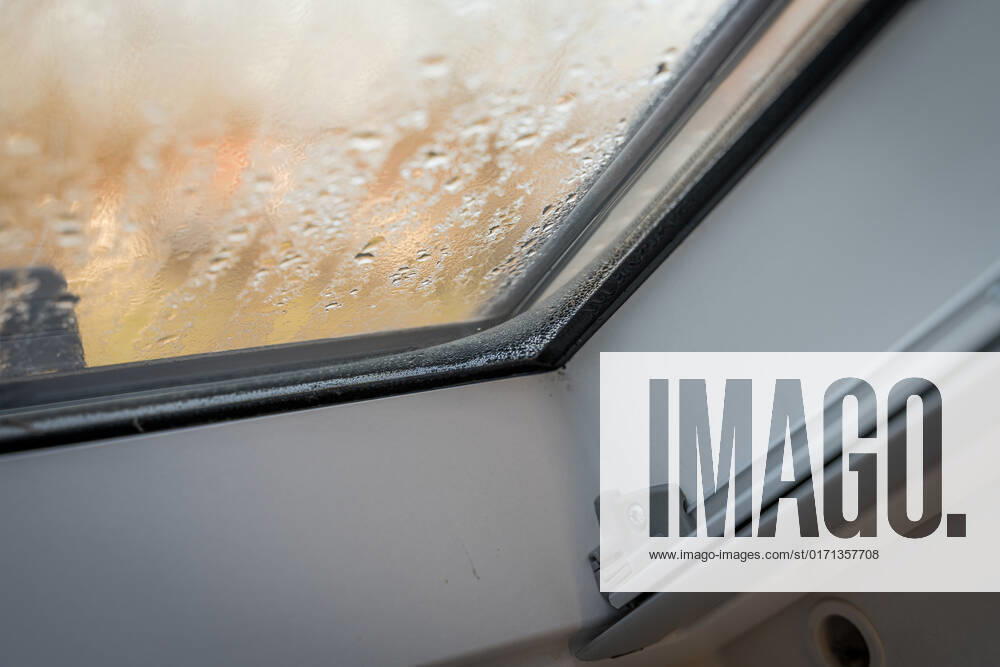 Germany, Bavaria - 31 October 2022: Fogged skylight in the morning. Water drops from condensation on a window