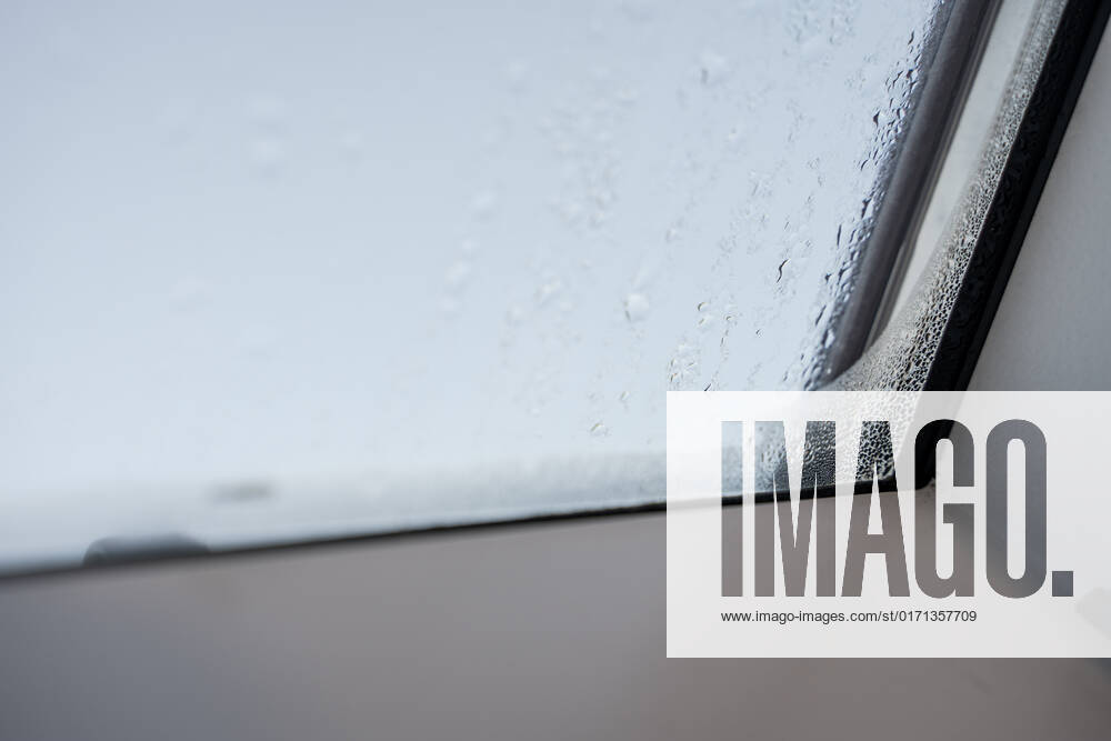 Germany, Bavaria - 31 October 2022: Fogged skylight in the morning. Water drops from condensation on a window