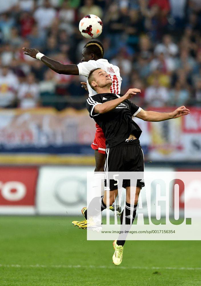 SOCCER - CL, RBS vs Qarabag SALZBURG,AUSTRIA,06.AUG.14 - SOCCER - UEFA Champions League, qualifying, Red Bull Salzburg vs Qarabag Agdam FK. Image shows Sadio Mane (RBS) and Maksim Medvedev (Qarabag).