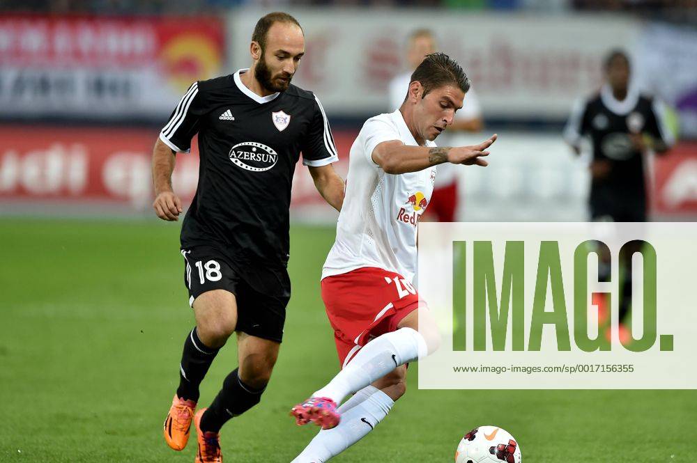 SOCCER - CL, RBS vs Qarabag SALZBURG,AUSTRIA,06.AUG.14 - SOCCER - UEFA Champions League, qualifying, Red Bull Salzburg vs Qarabag Agdam FK. Image shows Ilgar Gurbanov (Qarabag) and Jonatan Soriano (RBS).