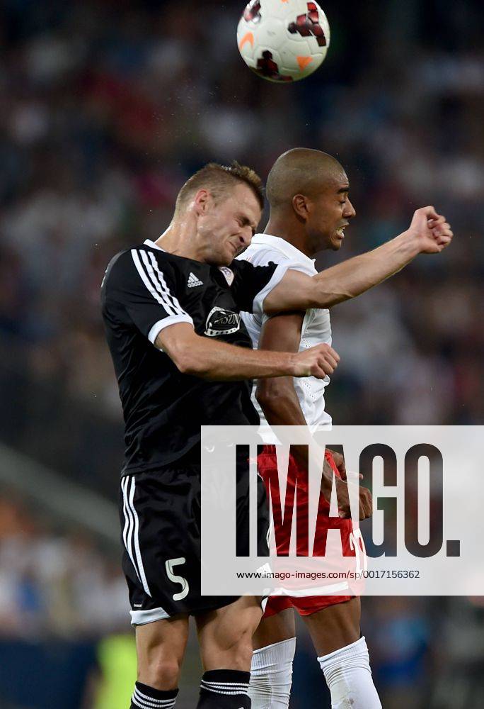 SOCCER - CL, RBS vs Qarabag SALZBURG,AUSTRIA,06.AUG.14 - SOCCER - UEFA Champions League, qualifying, Red Bull Salzburg vs Qarabag Agdam FK. Image shows Maksim Medvedev (Qarabag) and Alan de Carvalho (RBS).