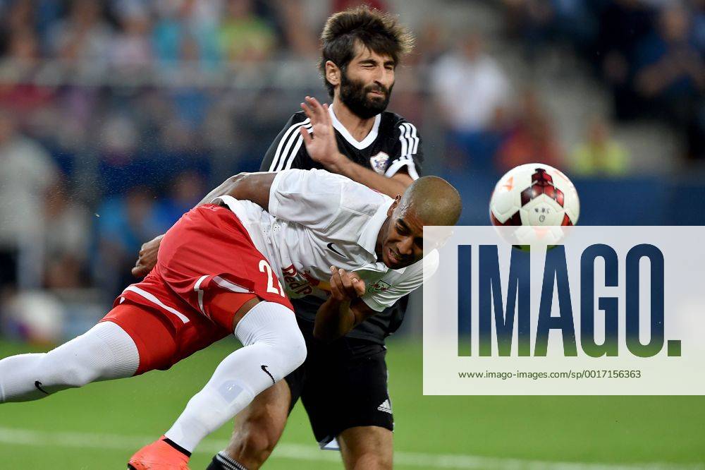SOCCER - CL, RBS vs Qarabag SALZBURG,AUSTRIA,06.AUG.14 - SOCCER - UEFA Champions League, qualifying, Red Bull Salzburg vs Qarabag Agdam FK. Image shows Alan de Carvalho (RBS) and Rashad Sadygov (Qarabag).