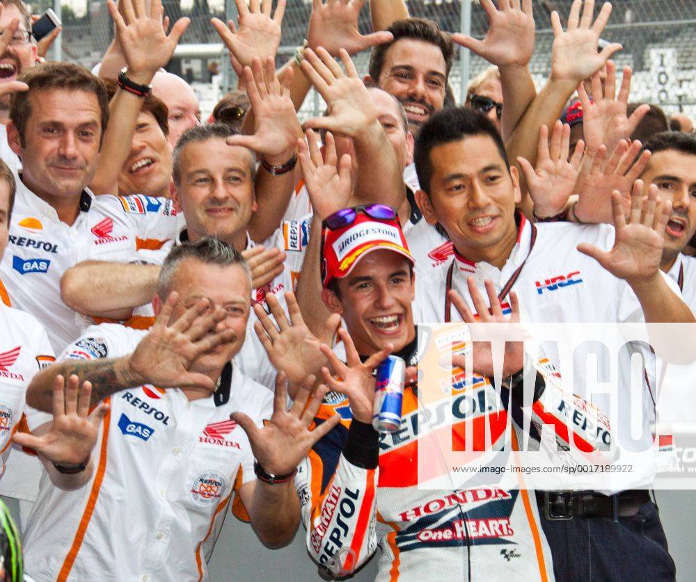 Marc Marquez and crew celebrate winning the 7th running of the Red Bull Moto GP at the Indianapolis Motor Speedway on August 10, 2014 in Indianapolis, Indiana. The 10 fingers signify his 10th consecutive win this Moto GP season. IND20140801007