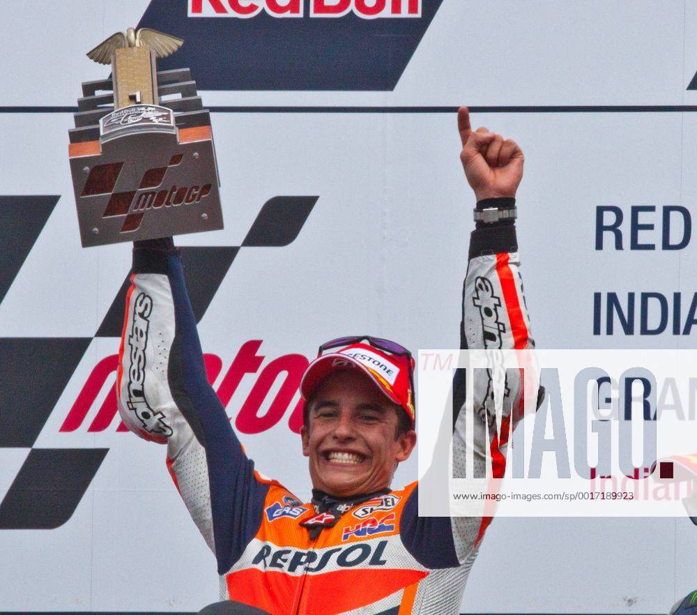 Marc Marquez raises his trophy after winning his second consecutive Red Bull Moto GP at the Indianapolis Motor Speedway on August 10, 2014 in Indianapolis, Indiana. IND20140801009