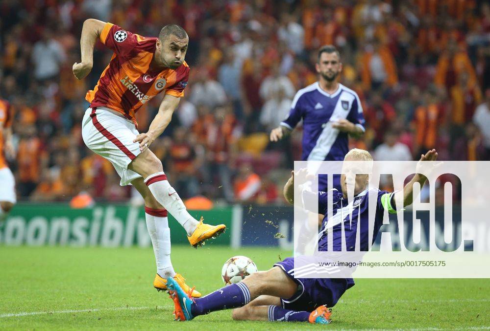 ISTANBUL - Galatasaray s Burak Yilmaz and Anderlecht s Olivier Deschacht fight for the ball during a soccer game between Turkish team Galatasaray S.K. and Belgian team RSC Anderlecht in the Tuk Telekom Arena in Istanbul, Turkey, Tuesday 16 September 2014, on day 1 of the group stage of the UEFA Champions League competition, in group D. VIRGINIExLEFOUR premiumd Highlight 04316874