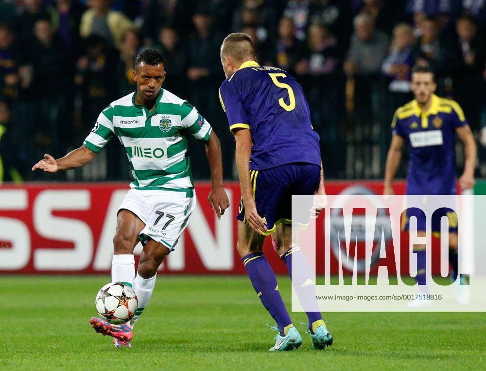SOCCER - CL, Maribor vs Sporting MARIBOR,SLOVENIA,17.SEP.14 - SOCCER - UEFA Champions League, group stage, NK Maribor vs Sporting Clube de Portugal. Image shows Nani (Sporting) and Zeljko Filipovic (Maribor).