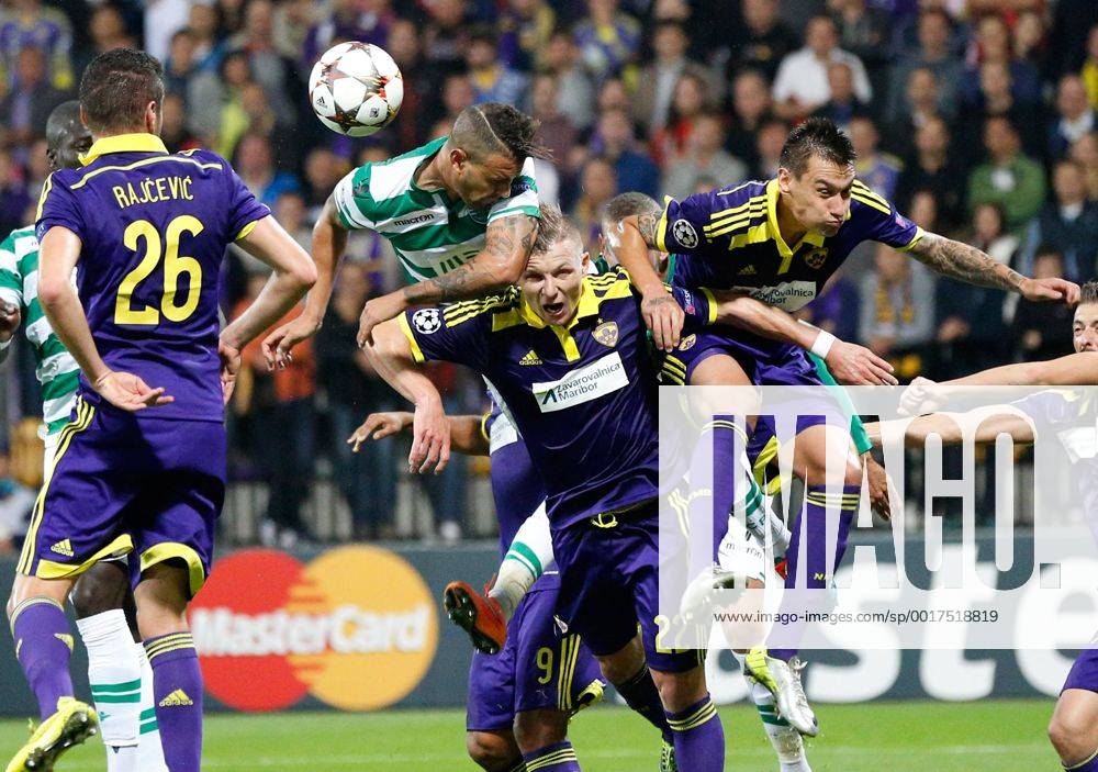 SOCCER - CL, Maribor vs Sporting MARIBOR,SLOVENIA,17.SEP.14 - SOCCER - UEFA Champions League, group stage, NK Maribor vs Sporting Clube de Portugal. Image shows Aleksander Rajcevic (Maribor), Islam Slimani (Sporting) and Nejc Potokar (Maribor)