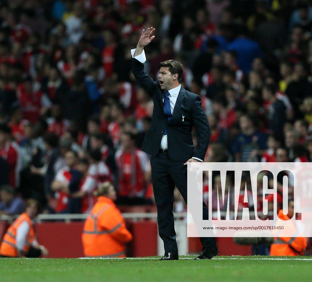 Tottenham s Mauricio Pochettino in action - Barclays Premier League - Arsenal vs Tottenham Hotspur - Emirates Stadium - England - 27th September 2014 - .