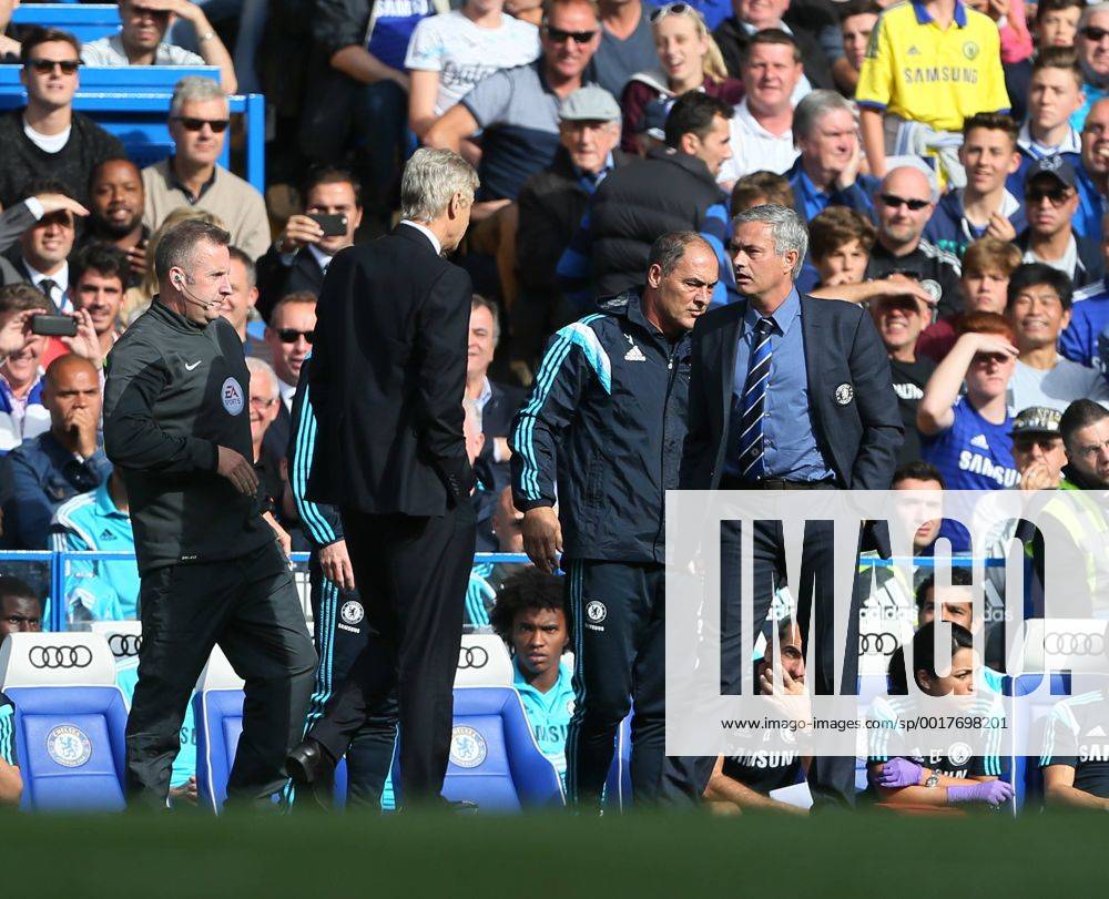 Chelsea s Jose Mourinho and Arsenal s Arsene Wenger square up to each other - Barclays Premier League - Chelsea Fc vs FC Arsenal - Stamford Bridge - England - 5th October 2014 - .