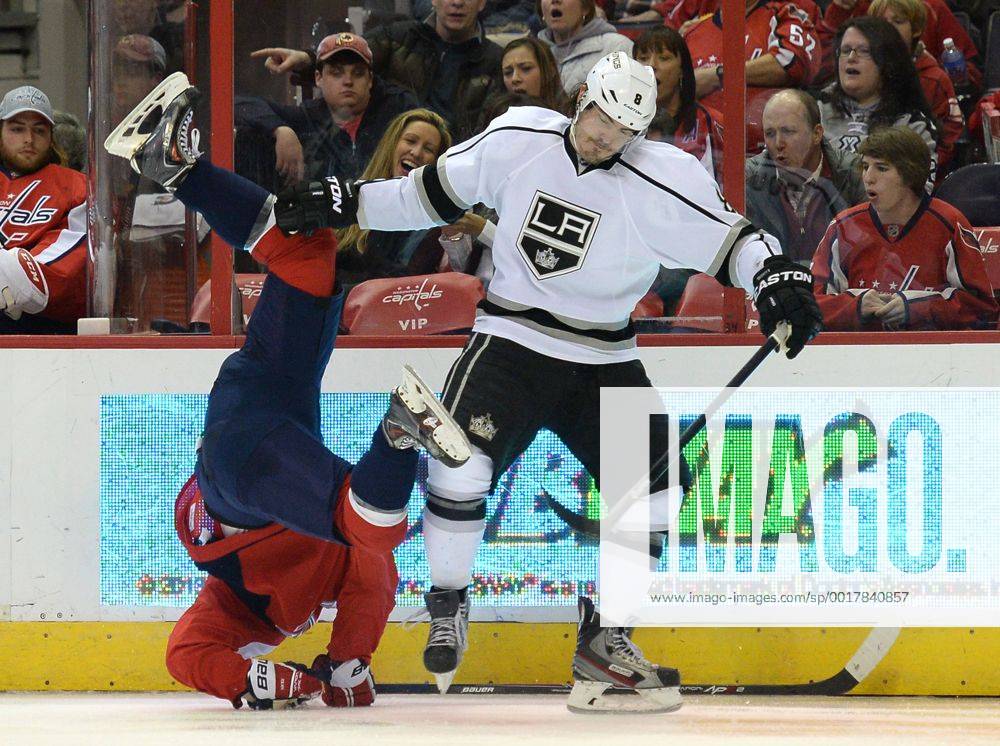 Washington, District of Columbia, U.S. - Los Angeles Kings defenseman DREW DOUGHTY (8) drops Washington Capitals center NICKLAS BACKSTROM (19) to the ice with a check in the second period at the Verizon Center. The Kings won the game 5-4. NHL Eishockey Herren USA 2014 - Kings Beat Capitals 5-4 - ZUMAm67_