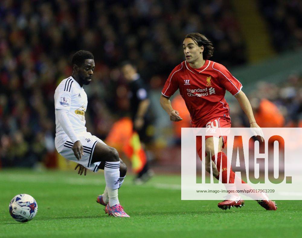 Liverpool s Lazer Markovic tussles with Swansea s Nathan Dyer League Cup Fourth Round- Liverpool vs Swansea City - Anfield - England - 28th October 2014 - Picture David Klein Sportimage .