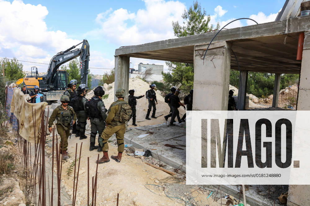 Israeli bulldozers demolish two Palestinian-owned houses in the village of al-Walaja, northwest of the West Bank city of Bethlehem Israeli bulldozers demolish two Palestinian-owned houses in the village of al-Walaja, northwest of the West Bank city of Bethlehem, Palestinain sources confirmed on November 2, 2022. Israeli forces raided the said village and demolished a house owned by local resident Othman al-Shweiki, and demolished another house owned by resident Khitam Ridwan. Photo by Ahmad Tayem APAimages Bethlehem West Bank Palestinian Territory 021122_Bethlehem_AT_00 (3)