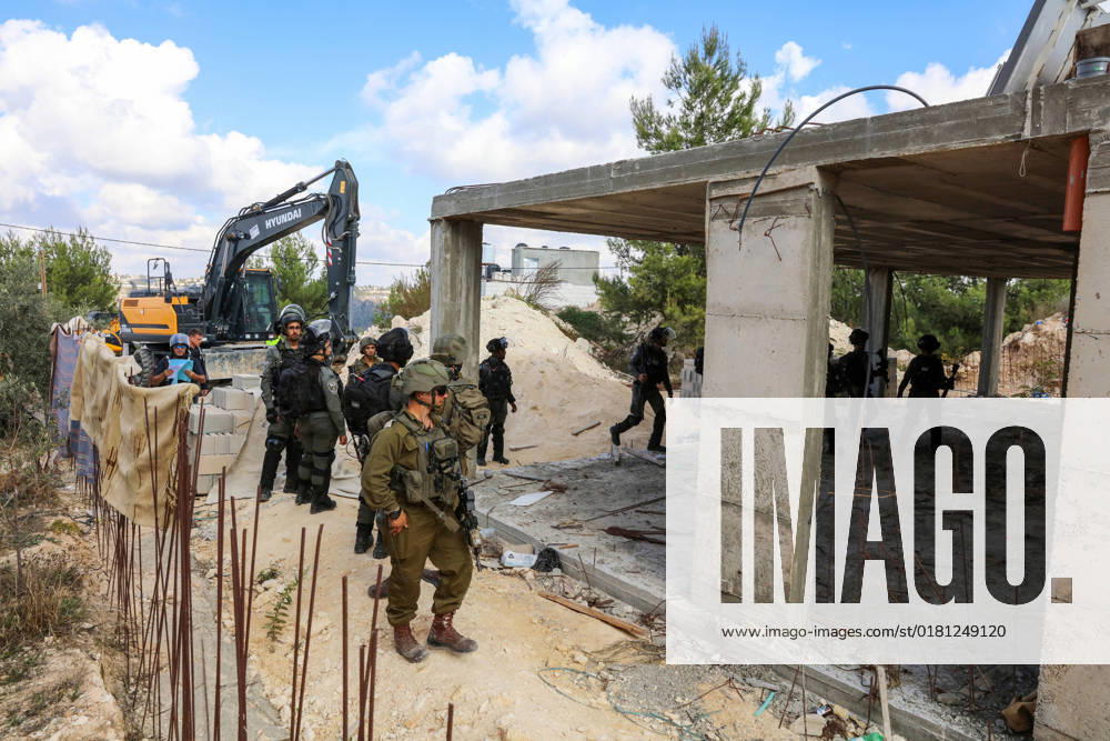 Israeli bulldozers demolish two Palestinian-owned houses in the village of al-Walaja, northwest of the West Bank city of Bethlehem Israeli bulldozers demolish two Palestinian-owned houses in the village of al-Walaja, northwest of the West Bank city of Bethlehem, Palestinain sources confirmed on November 2, 2022. Israeli forces raided the said village and demolished a house owned by local resident Othman al-Shweiki, and demolished another house owned by resident Khitam Ridwan. Photo by Ahmad Tayem APAimages Bethlehem West Bank Palestinian Territory 021122_Bethlehem_AT_00 (4)