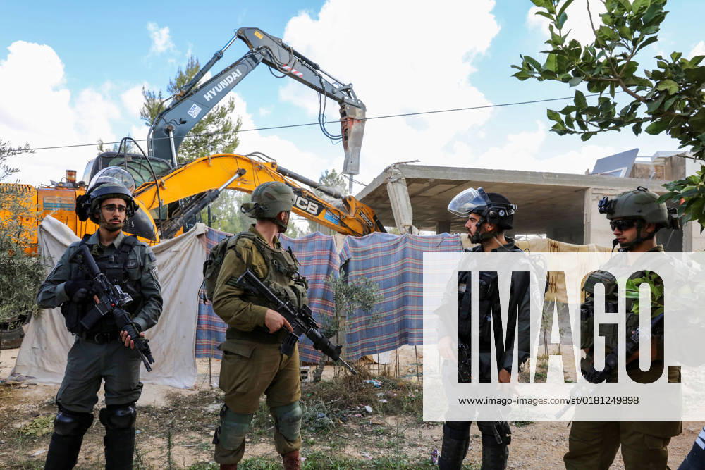 Israeli bulldozers demolish two Palestinian-owned houses in the village of al-Walaja, northwest of the West Bank city of Bethlehem Israeli bulldozers demolish two Palestinian-owned houses in the village of al-Walaja, northwest of the West Bank city of Bethlehem, Palestinain sources confirmed on November 2, 2022. Israeli forces raided the said village and demolished a house owned by local resident Othman al-Shweiki, and demolished another house owned by resident Khitam Ridwan. Photo by Ahmad Tayem APAimages Bethlehem West Bank Palestinian Territory 021122_Bethlehem_AT_00 (12)