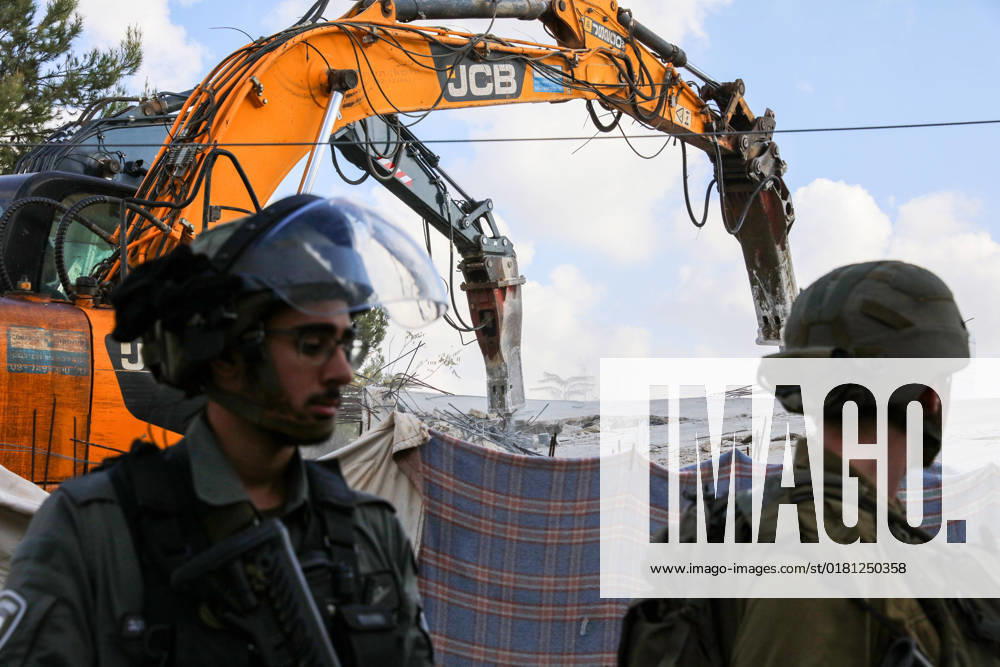 Israeli bulldozers demolish two Palestinian-owned houses in the village of al-Walaja, northwest of the West Bank city of Bethlehem Israeli bulldozers demolish two Palestinian-owned houses in the village of al-Walaja, northwest of the West Bank city of Bethlehem, Palestinain sources confirmed on November 2, 2022. Israeli forces raided the said village and demolished a house owned by local resident Othman al-Shweiki, and demolished another house owned by resident Khitam Ridwan. Photo by Ahmad Tayem APAimages Bethlehem West Bank Palestinian Territory 021122_Bethlehem_AT_00 (14)