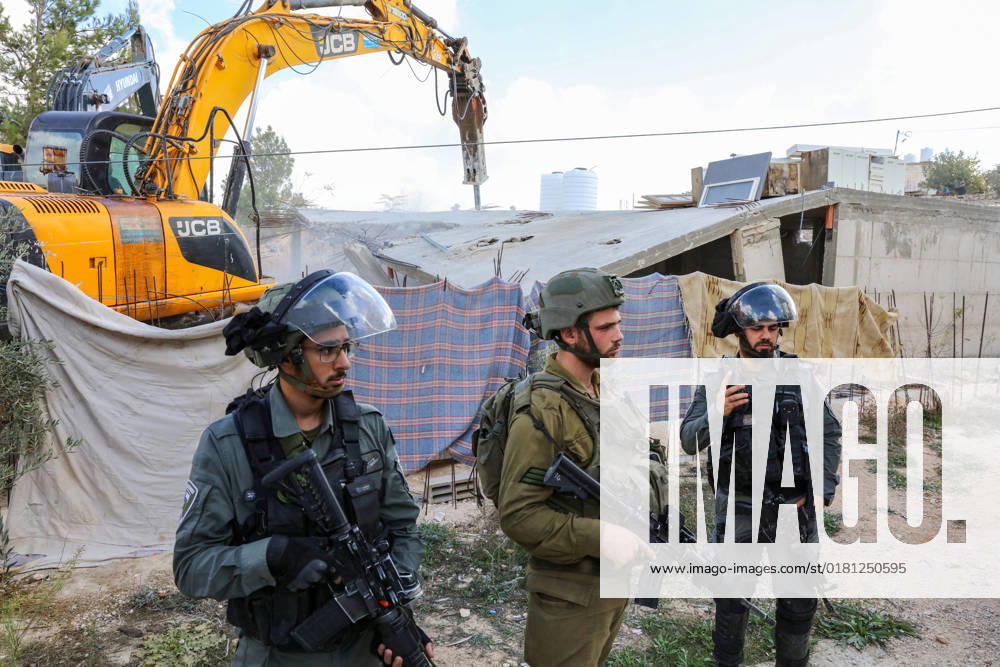 Israeli bulldozers demolish two Palestinian-owned houses in the village of al-Walaja, northwest of the West Bank city of Bethlehem Israeli bulldozers demolish two Palestinian-owned houses in the village of al-Walaja, northwest of the West Bank city of Bethlehem, Palestinain sources confirmed on November 2, 2022. Israeli forces raided the said village and demolished a house owned by local resident Othman al-Shweiki, and demolished another house owned by resident Khitam Ridwan. Photo by Ahmad Tayem APAimages Bethlehem West Bank Palestinian Territory 021122_Bethlehem_AT_00 (15)