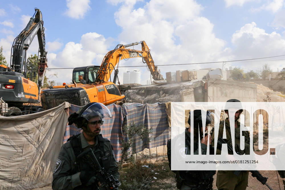 Israeli bulldozers demolish two Palestinian-owned houses in the village of al-Walaja, northwest of the West Bank city of Bethlehem Israeli bulldozers demolish two Palestinian-owned houses in the village of al-Walaja, northwest of the West Bank city of Bethlehem, Palestinain sources confirmed on November 2, 2022. Israeli forces raided the said village and demolished a house owned by local resident Othman al-Shweiki, and demolished another house owned by resident Khitam Ridwan. Photo by Ahmad Tayem APAimages Bethlehem West Bank Palestinian Territory 021122_Bethlehem_AT_00 (18)