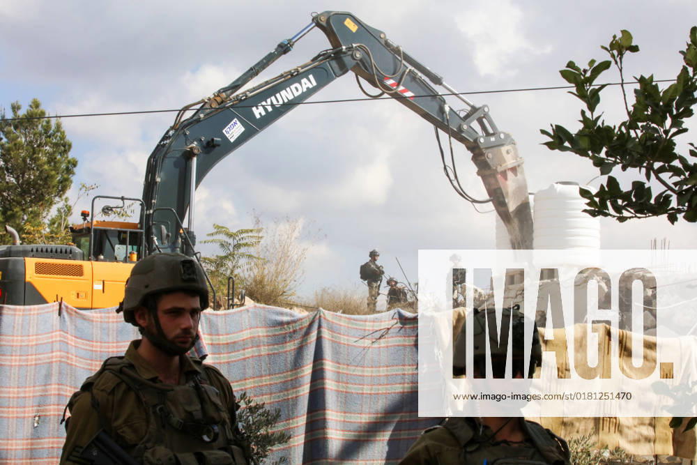 Israeli bulldozers demolish two Palestinian-owned houses in the village of al-Walaja, northwest of the West Bank city of Bethlehem Israeli bulldozers demolish two Palestinian-owned houses in the village of al-Walaja, northwest of the West Bank city of Bethlehem, Palestinain sources confirmed on November 2, 2022. Israeli forces raided the said village and demolished a house owned by local resident Othman al-Shweiki, and demolished another house owned by resident Khitam Ridwan. Photo by Ahmad Tayem APAimages Bethlehem West Bank Palestinian Territory 021122_Bethlehem_AT_00 (19)