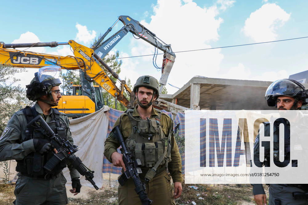 Israeli bulldozers demolish two Palestinian-owned houses in the village of al-Walaja, northwest of the West Bank city of Bethlehem Israeli bulldozers demolish two Palestinian-owned houses in the village of al-Walaja, northwest of the West Bank city of Bethlehem, Palestinain sources confirmed on November 2, 2022. Israeli forces raided the said village and demolished a house owned by local resident Othman al-Shweiki, and demolished another house owned by resident Khitam Ridwan. Photo by Ahmad Tayem APAimages Bethlehem West Bank Palestinian Territory 021122_Bethlehem_AT_00 (11)