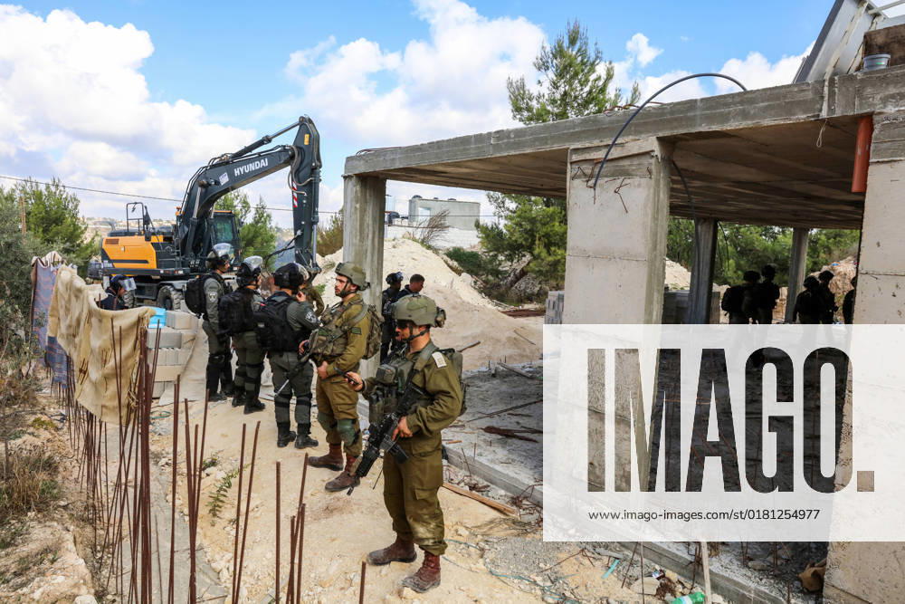 Israeli bulldozers demolish two Palestinian-owned houses in the village of al-Walaja, northwest of the West Bank city of Bethlehem Israeli bulldozers demolish two Palestinian-owned houses in the village of al-Walaja, northwest of the West Bank city of Bethlehem, Palestinain sources confirmed on November 2, 2022. Israeli forces raided the said village and demolished a house owned by local resident Othman al-Shweiki, and demolished another house owned by resident Khitam Ridwan. Photo by Ahmad Tayem APAimages Bethlehem West Bank Palestinian Territory 021122_Bethlehem_AT_00 (5)
