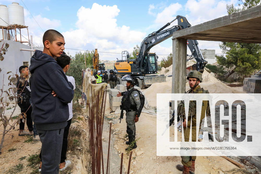Israeli bulldozers demolish two Palestinian-owned houses in the village of al-Walaja, northwest of the West Bank city of Bethlehem Israeli bulldozers demolish two Palestinian-owned houses in the village of al-Walaja, northwest of the West Bank city of Bethlehem, Palestinain sources confirmed on November 2, 2022. Israeli forces raided the said village and demolished a house owned by local resident Othman al-Shweiki, and demolished another house owned by resident Khitam Ridwan. Photo by Ahmad Tayem APAimages Bethlehem West Bank Palestinian Territory 021122_Bethlehem_AT_00 (7)