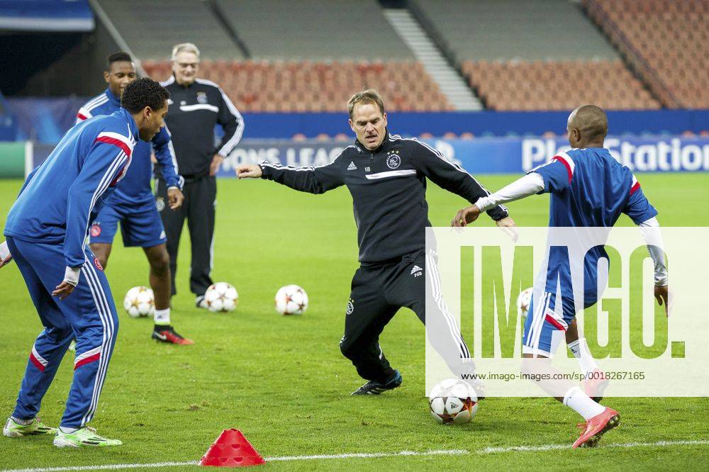 (L-R) Jairo Riedewald of Ajax, Stefano Denswil of Ajax, assistant trainer Hennie Spijkerman of Ajax, coach Frank de Boer of Ajax, Thulani Serero of Ajax during a training session of Ajax Amsterdam prior to the UEFA Champions League group F match between Paris Saint-Germain and Ajax Amsterdam on November 24, 2014 at the Parc de Princes stadium in Paris, France. Training session Ajax UEFA Champions League Group F 2014 2015 IVx 3298911