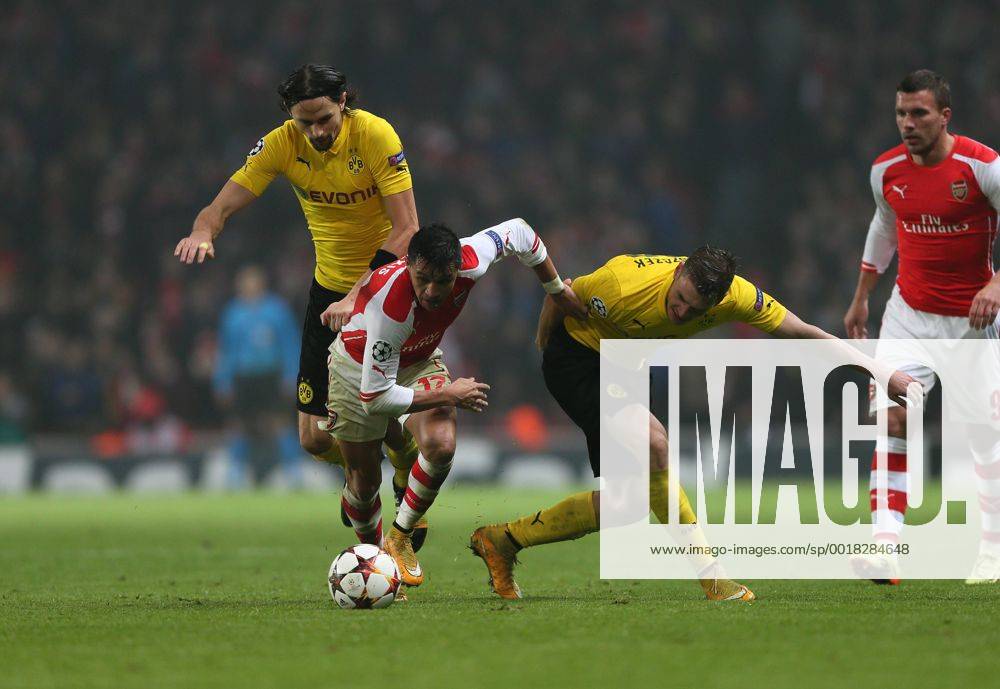Arsenal s Alexis Sanchez tussles with Dortmund s Neven Subotic and Kevin Grosskreutz UEFA Champions League- Arsenal vs Borussia Dortmund- Emirates Stadium - England - 26th November 2014 - .