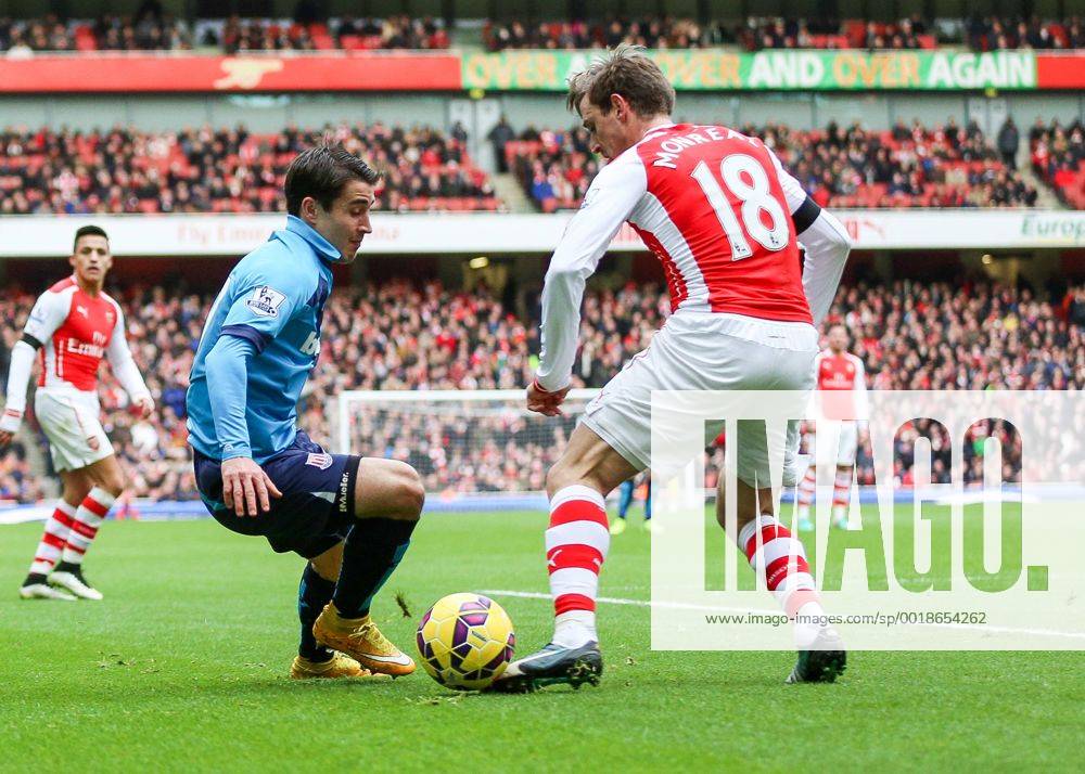 Football - 2014 2015 - Barclays Premier League, - Arsenal Vs Stoke City, Stoke City s Bojan Krkic cuts inside Arsenal s Nacho Monreal at The Emirates Stadium COLORSPORT DANIEL BEARHAM ARS_STO