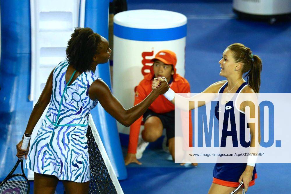 Venus Williams of the United States shakes hands with Agnieszka Radwanska of Poland during day eight of the 2015 Australian Open at Melbourne Park on January 26, 2015 in Melbourne, Australia. CFP462339980