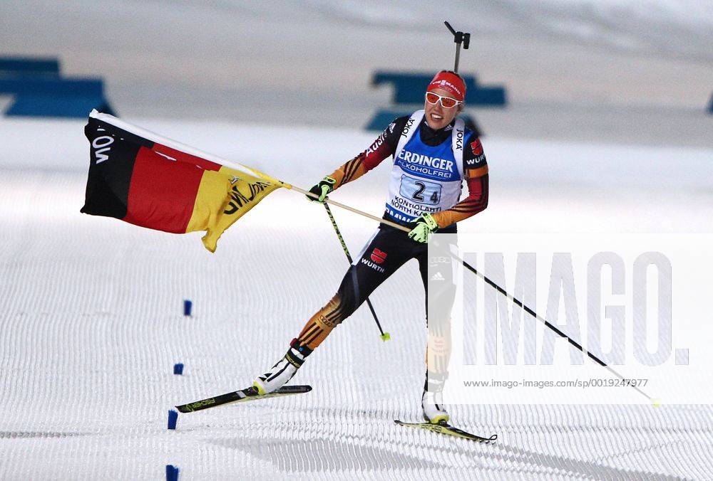 KONTIOLAHTI, FINLAND. MARCH 13, 2015. Gold medalist, biathlete Laura Dahlmeier of Germany waves her national flag as she crosses the finish line in the 2015 IBU Biathlon World Championships women s 4x6km relay in Kontiolahti, Finland. Stanislav Krasilnikov TASS RE15E509