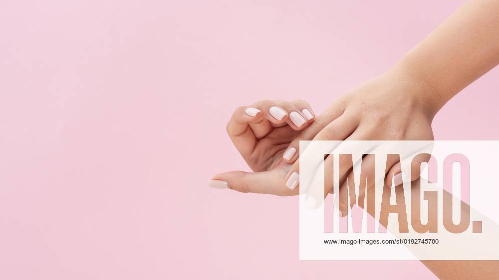 Woman shows their Manicure at Pink Background with Kopierraum Resolution and high Quality Beautiful Photo