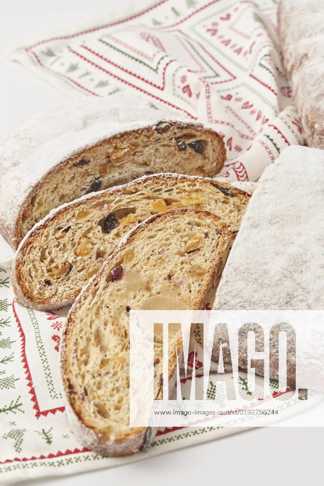 Slices of Christmas stollen cake on napkin, YDF00038