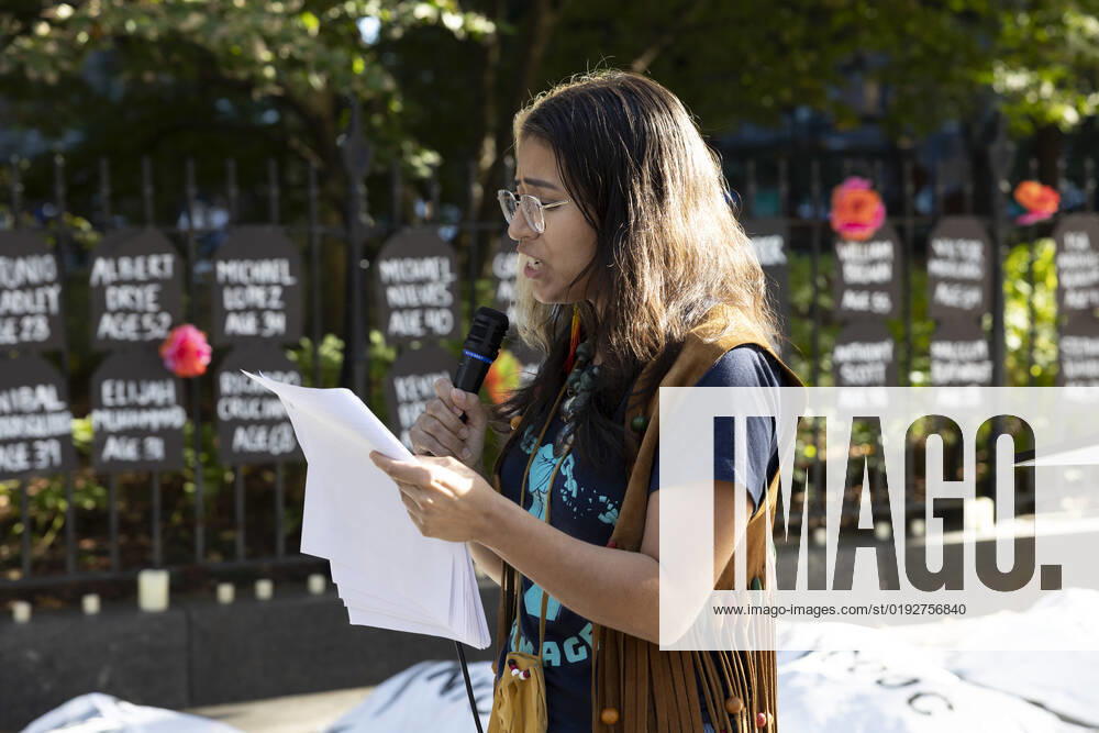 GRACE ORTEZ with Freedom Agenda addresses rally attendees. A coalition of organizations hold a rally and vigil at City Hall Park in remembrance of the eighteen people who died in NYC jails so far in 2022. Demonstrators create an installation representing eighteen bodies covered by shrouds that read NYC DOC (Department of Corrections) on the street. Earlier in the week Gilberto Garcia, 26 years old, died while detained at Rikers Island. 18 Hours of Action To End NYCâ€⠢s Death Penalty is an all day rally where organizers call on Mayor Adams and city officials to close Rikers Island now and decarcerate city jails. New York USA - ZUMAr174 20221103_znp_r174_004