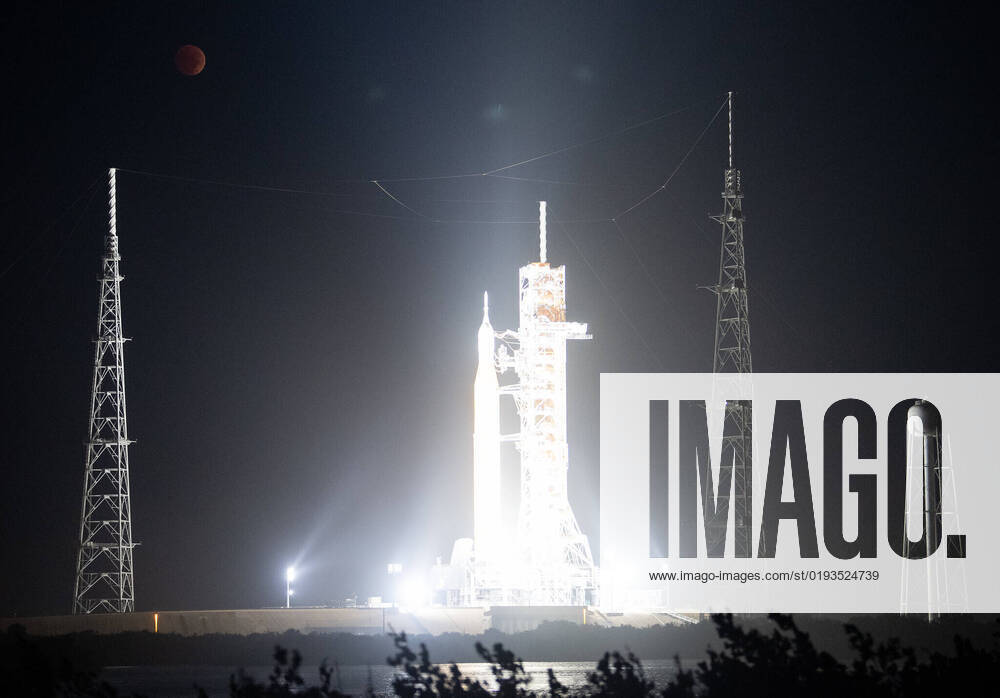 The Moon is seen during a total lunar eclipse above NASA?s Artemis I mission s Space Launch System (SLS) rocket with the Orion spacecraft aboard atop a mobile launcher at Launch Pad 39B, Tuesday, Nov. 8, 2022, at NASA?s Kennedy Space Center in Florida. NASA?s Artemis I flight test is the first integrated test of the agency?s deep space exploration systems: the Orion spacecraft, SLS rocket, and supporting ground systems. Where: Kennedy Space Center, Florida, United States When: 08 Nov 2022 Credit: NASA Joel Kowsky Cover Images **. MATERIALS ONLY TO BE USED IN CONJUNCTION WITH EDITORIAL STORY. THE USE OF THESE MATERIALS FOR ADVERTISING, MARKETING OR ANY OTHER COMMERCIAL PURPOSE IS STRICTLY PROHIBITED. MATERIAL COPY