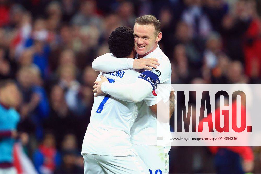 Wayne Rooney of England celebrates with goalscorer Raheem Sterling - England vs. Lithuania - UEFA EURO EM Europameisterschaft Fussball 2016 Qualifier - Wembley Stadium - London - 27 03 2015 Pic Philip Oldham Sportimage .