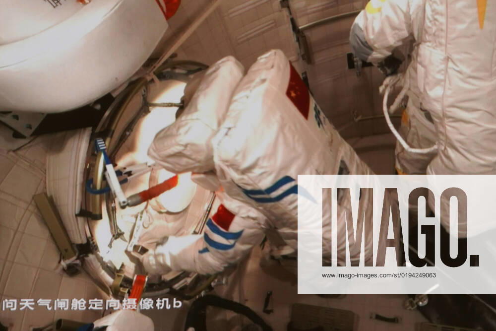 (221117) -- BEIJING, Nov. 17, 2022 -- This screen image captured at Beijing Aerospace Control Center on Nov. 17, 2022 shows China s Shenzhou-14 taikonaut Chen Dong (L) closing the hatch of space station lab module Wentian s airlock cabin after finishing extravehicular activities. The Shenzhou-14 crew on board the orbiting Chinese Tiangong space station completed their third spacewalk at 4:50 p.m. (Beijing Time) on Thursday, according to the China Manned Space Agency. Chen Dong and Cai Xuzhe -- together with Liu Yang who worked inside the core module to support her crewmates -- collaborated to pull off all set tasks. Chen and Cai have since safely returned to the Wentian lab. (Photo by Sun Fengxiao Xinhua) (EyesonSci) CHINA-SHENZHOU-14-T