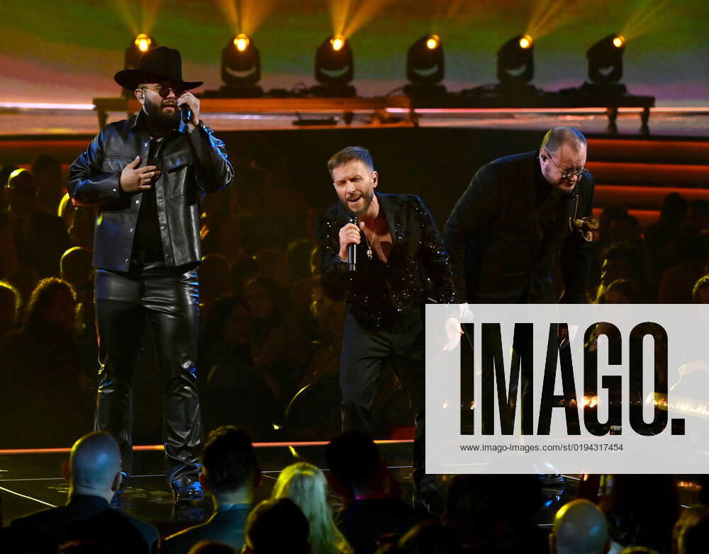 (L-R) Carin León performs with Noel Schajris and Leonel García of Sin Bandera onstage during the 23rd annual Latin Grammy Awards at the Michelob Ultra Arena at Mandalay Bay Resort and Casino in Las Vegas, Nevada on Thursday, November 17, 2022. LAV20221117621 JIMxRUYMEN