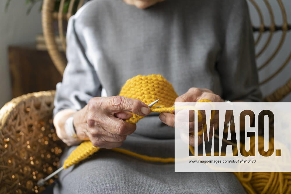 Hands of senior woman knitting at home model released, Symbolfoto property released, SVKF00684