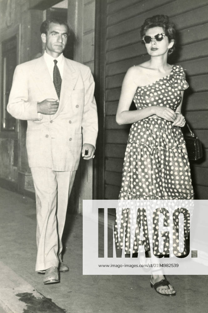 The Shah of Iran Mohammad Reza Pahlavi and Empress Soraya Esfandiary-Bakhtiary strolling in the street, Rome, Italy 1960