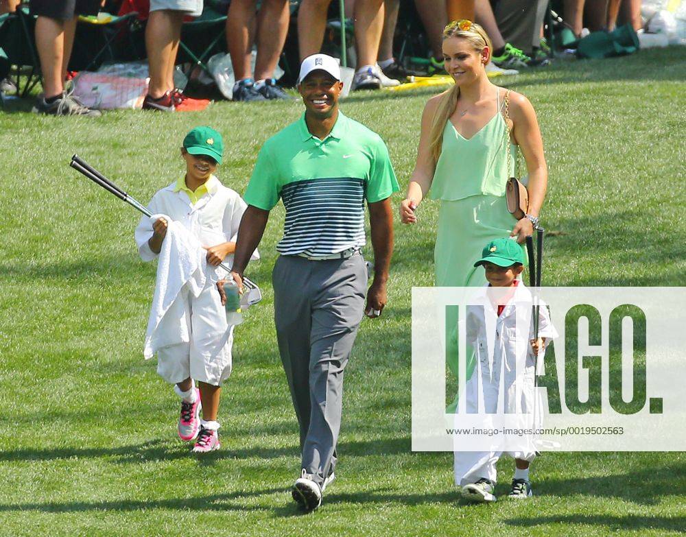 Augusta, Georgia, U.S. - TIGER WOODS, LINDSEY VONN, and his children SAM and CHARLIE walk down the sixth fairway during the Par 3 Contest on Wednesday at Augusta National Golf Club. Golf 2015 - The Masters - Practice Round - ZUMAm67_