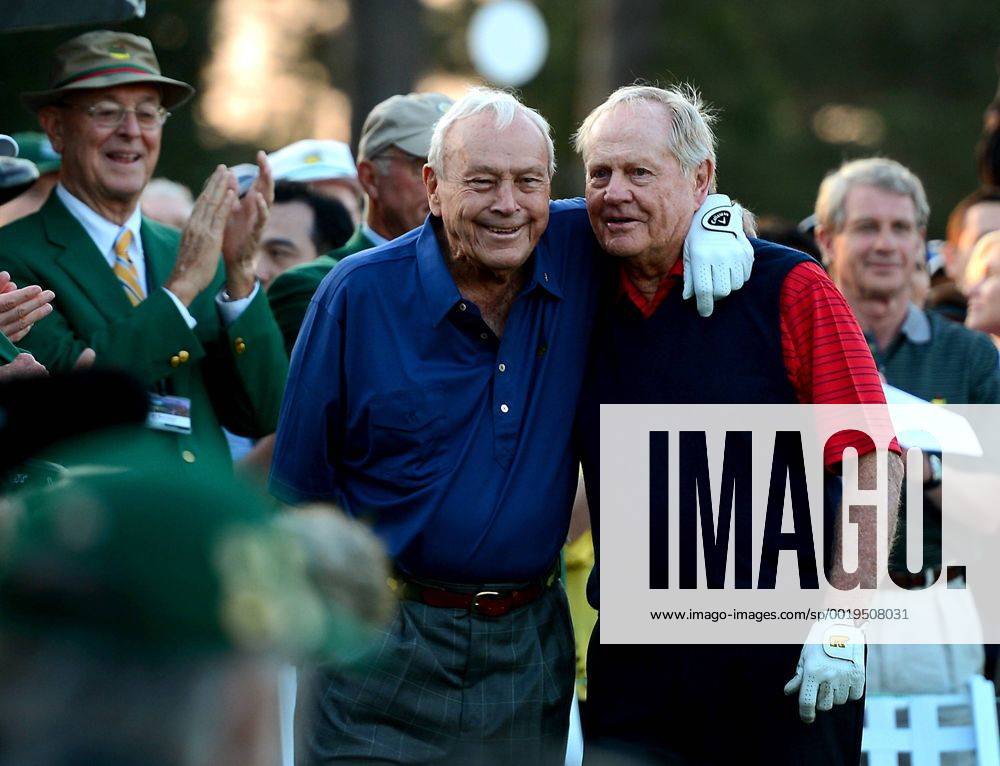 Augusta, GA, USA - Arnold Palmer, left, hugs Jack Nicklaus, right, at the first tee box on Thursday, April 9, 2015 in Augusta, Ga. The two along with Gary Player were honorary starters of the 2015 Masters Tournament at Augusta National Golf Club. Masters begins - ZUMAm67_