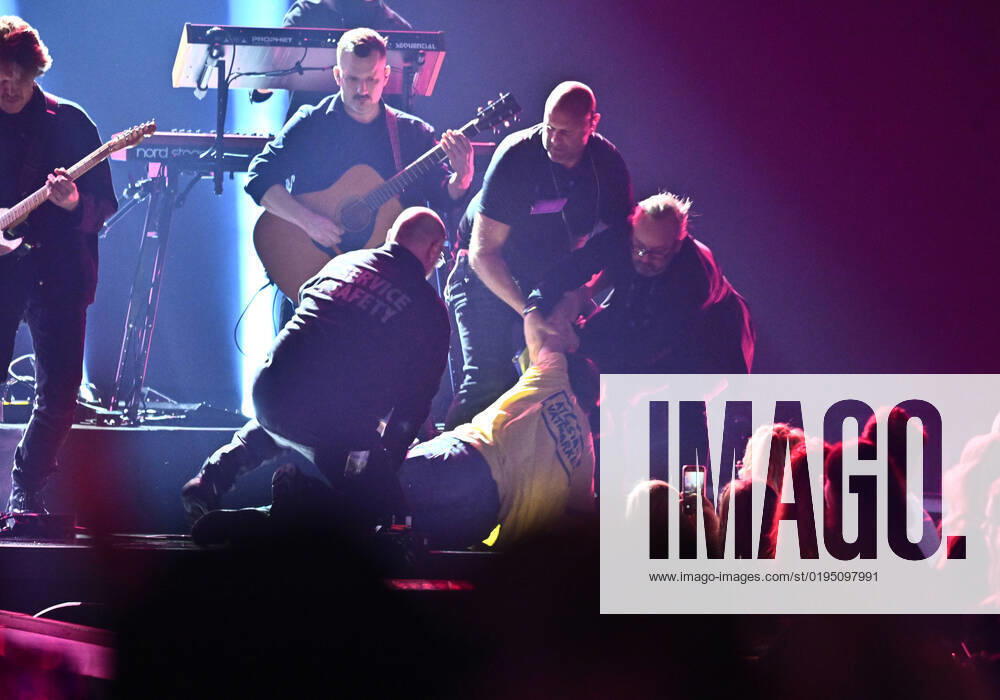 STOCKHOLM 20221125 An activist is removed from the stage during Miss Lis performance during Friday nights Idol final in Tele2 Arena Stockholm Sweden