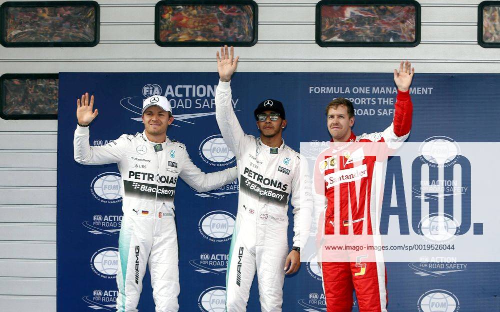(150411) -- SHANGHAI, April 11, 2015 -- Mercedes driver Lewis Hamilton(C) of Britain waves with teammate Nico Rosberg(L) of Germany and Ferrari driver Sebastian Vettel of Germany after getting pole in the qualifying session for the Chinese Formula One Grand Prix at Shanghai International Circuit in Shanghai, China, April 11, 2015. Hamilton took pole for Sunday s race. ) (SP)CHINA-SHANGHAI-F1-GRAND PRIX FanxJun