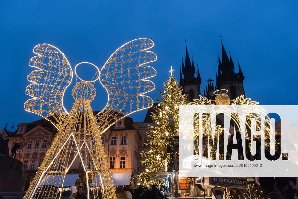 Illuminated Christmas tree and Angel decoration as seen on the traditional Christmas market at Old town Square in Prague. Prague Czech Republic - ZUMAs197 20221128_zaa_s197_279