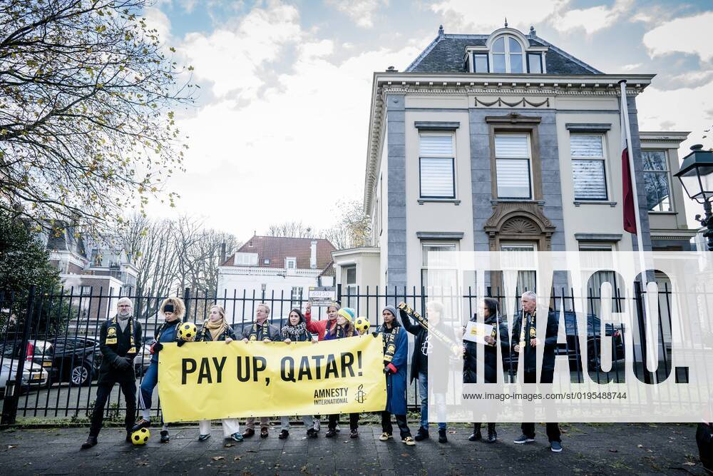 THE HAGUE Members of Amnesty International prior to offering signatures to the embassy of Qatar The human rights organization calls on Qatar and FIFA to compensate the affected migrant workers who made the World Cup possible ANP BART MAAT netherlands out belgium out