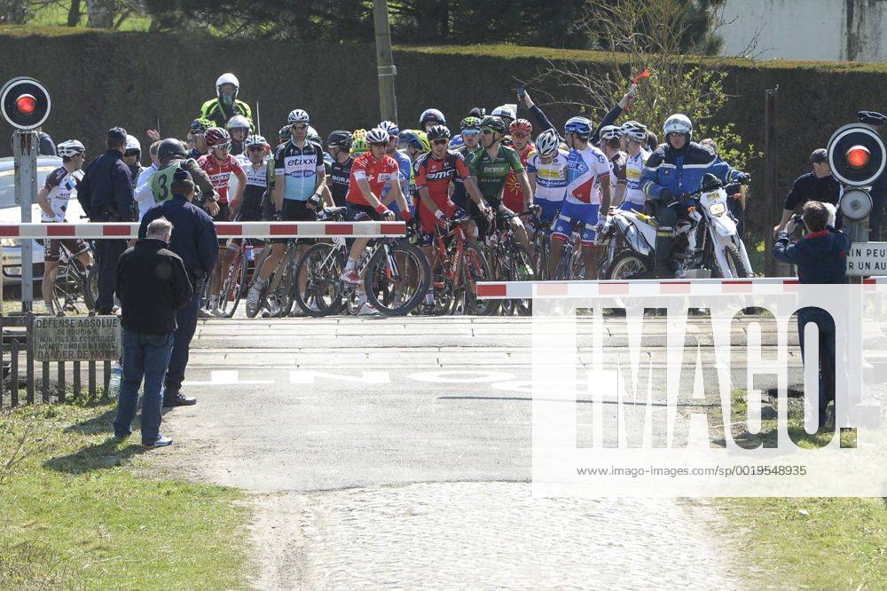 - ROUBAIX, FRANCE: Illustration picture shows the pack of riders passing a closed railroad crossing during the Paris-Roubaix one day cycling race, 253,5 km from Compiegne to the Velodrome in Roubaix, Sunday 12 April 2015. DIRKxWAEM x04603426x