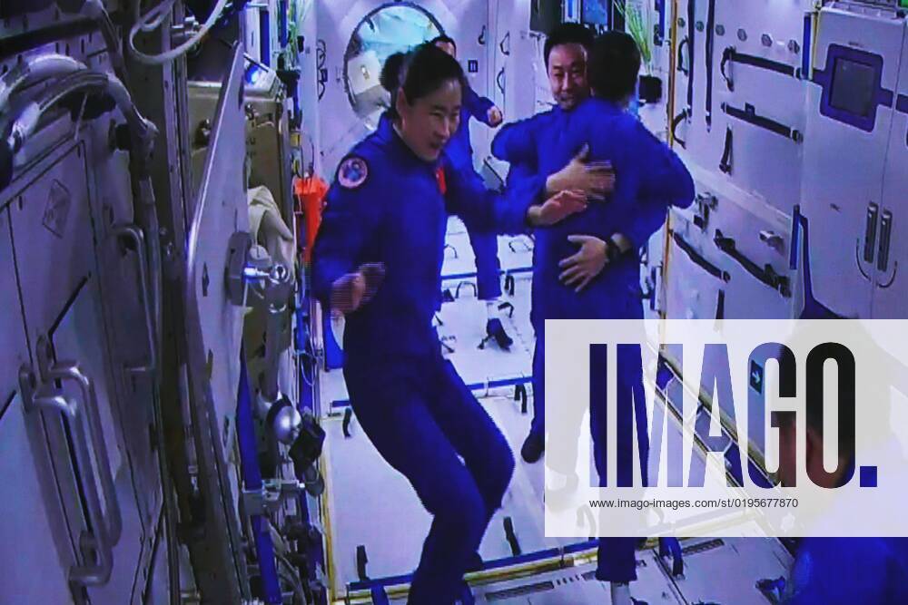 (221130) -- JIUQUAN, Nov. 30, 2022 -- This image captured at the Jiuquan Satellite Launch Center in northwest China shows the Shenzhou-14 astronauts Liu Yang and Cai Xuzhe greeting the Shenzhou-15 crew at the Wentian lab on Nov. 30, 2022. The three astronauts aboard China s Shenzhou-15 spaceship entered the country s space station and met with another astronaut trio on Wednesday, a historic gathering that added the manpower at the in-orbit space lab to six for the first time. Chen Dong, the commander of the Shenzhou-14 crew, opened the hatch at 7:33 a.m. (Beijing Time). The three space station occupants greeted the new arrivals with warm hugs and then they took a group picture with their thumbs up, shouting in chorus -- China s space