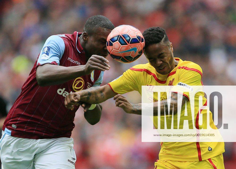 Aston Villa s Jores Okore tussles with Liverpool s Raheem Sterling The FA Cup - Semi Final- Aston Villa vs Liverpool - Wembley - England - 19th April 2015 - Picture David Klein Sportimage .
