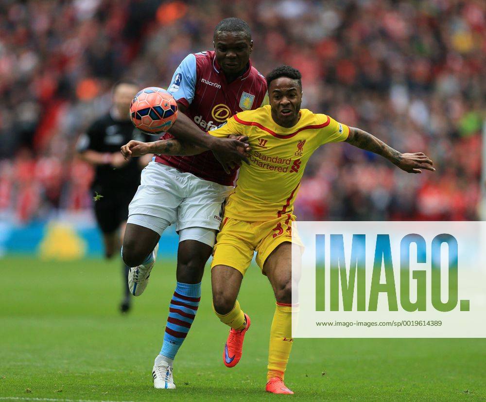 Aston Villa s Jores Okore tussles with Liverpool s Raheem Sterling The FA Cup - Semi Final- Aston Villa vs Liverpool - Wembley - England - 19th April 2015 - Picture David Klein Sportimage .